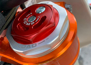 Motocross suspension adjuster